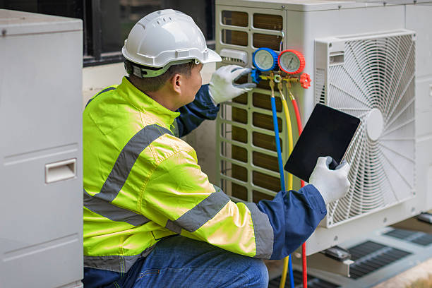 Professional Hvac technician working in Walpole, MA